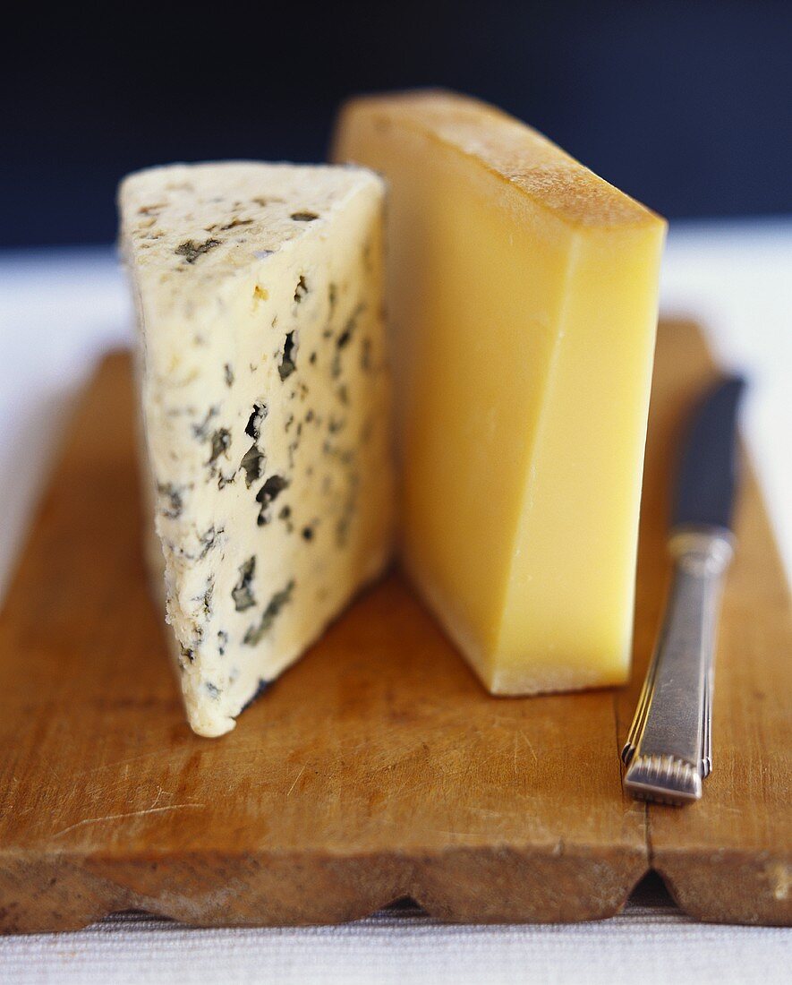 Roquefort and Gruyère on a wooden board