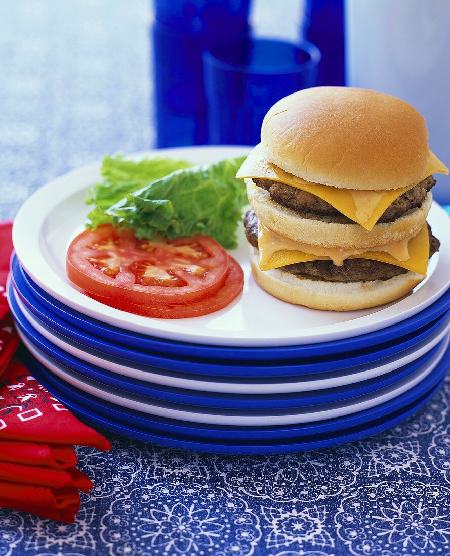 Double cheeseburger with tomatoes and lettuce