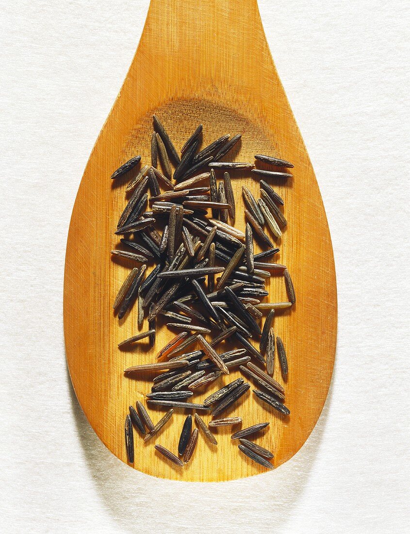 Wild rice on wooden spoon