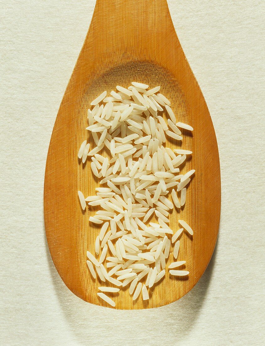 Basmati rice on wooden spoon