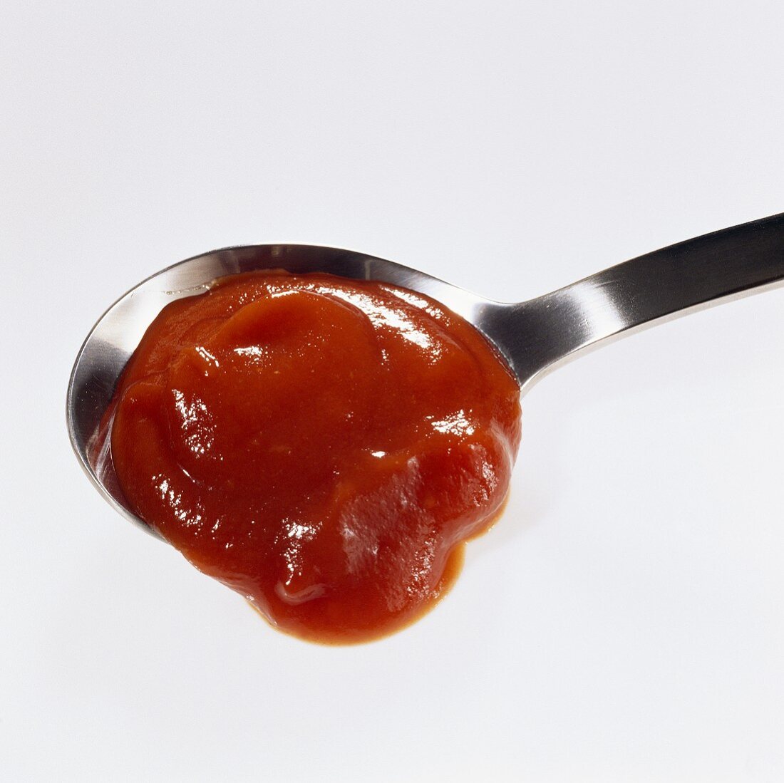 Ketchup in spoon