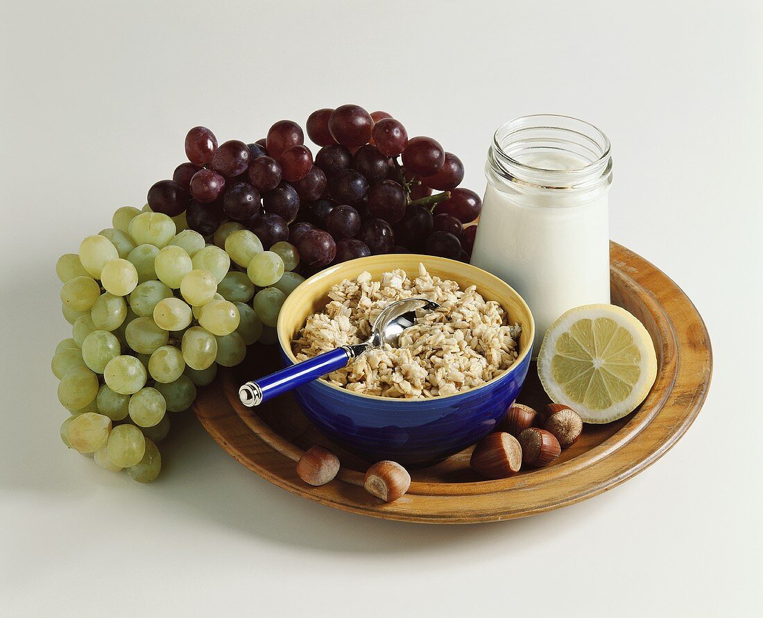Muesli with natural yoghurt, grapes and hazelnuts