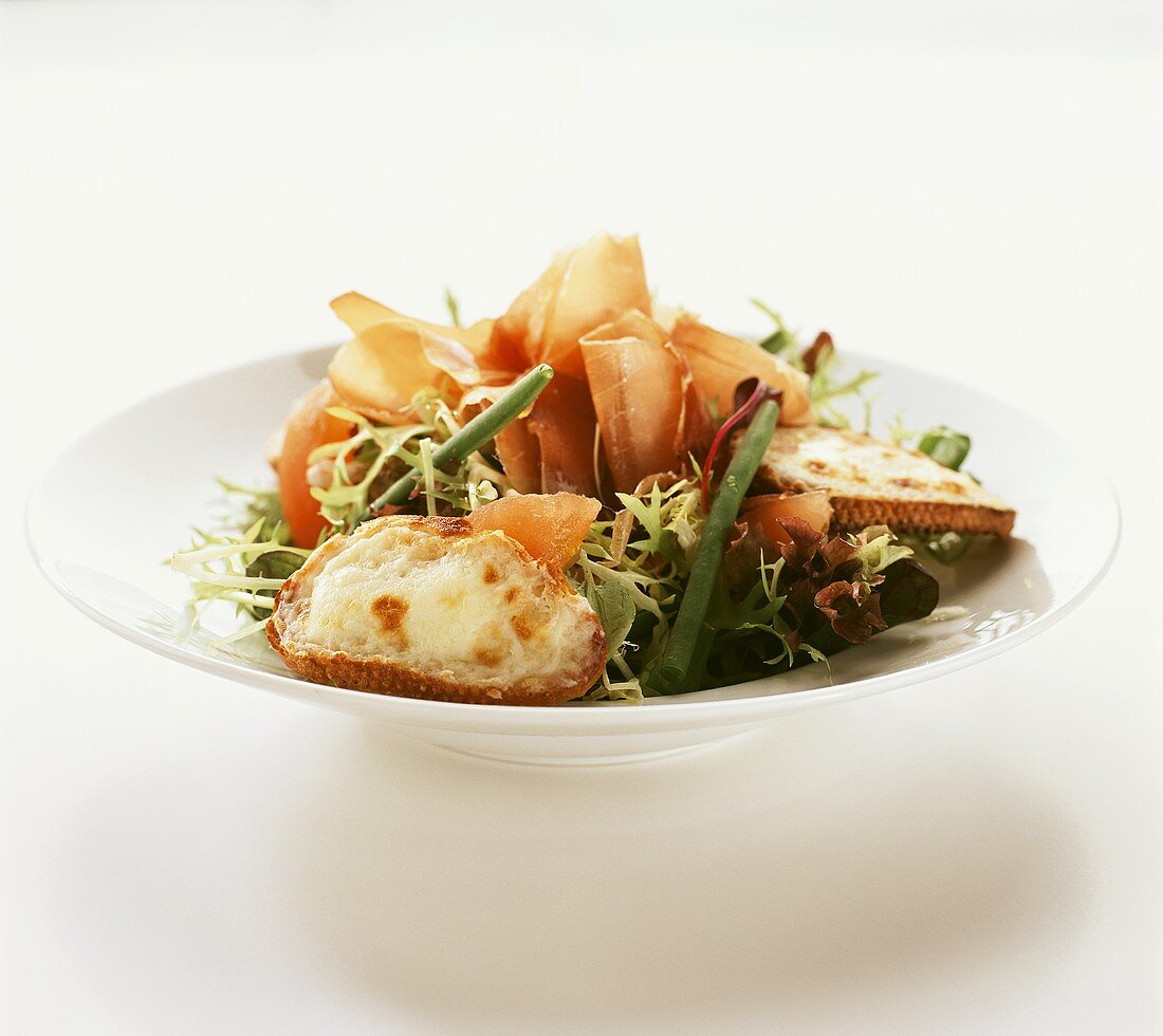Frisée (curly endive) with prosciutto and toasted cheese