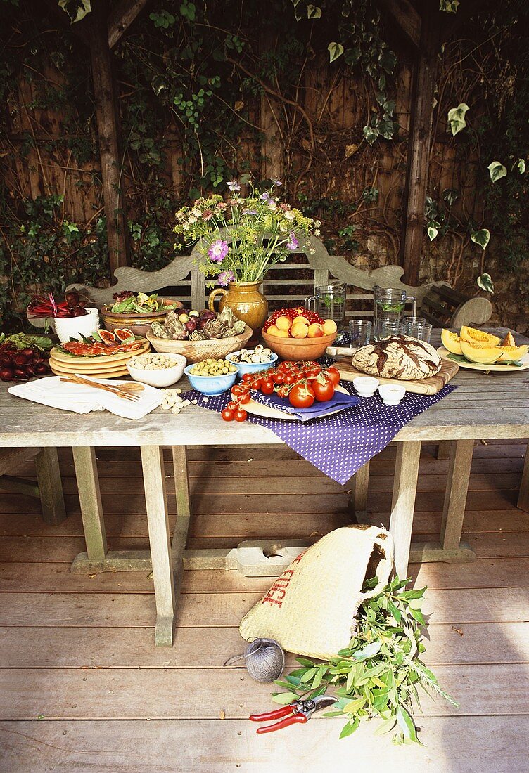 Laid garden table with vegetables and fruit