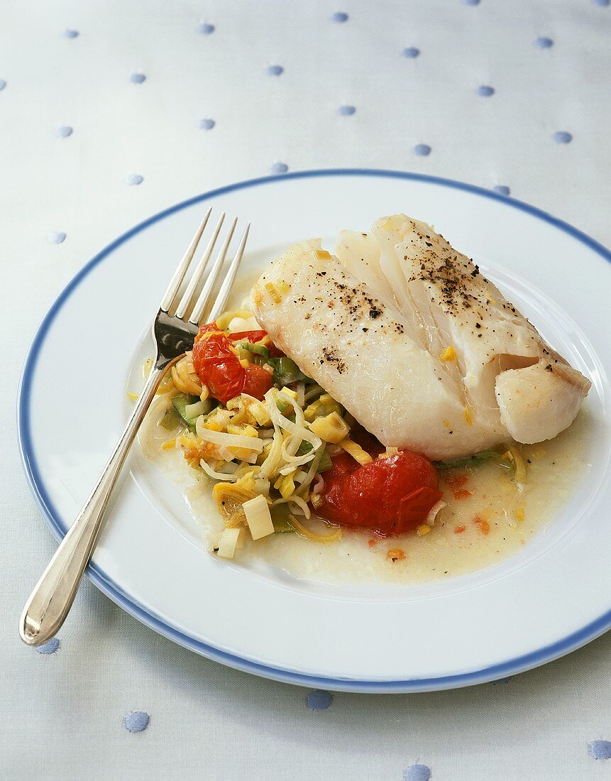 Sea bass fillet with leeks and cherry tomatoes