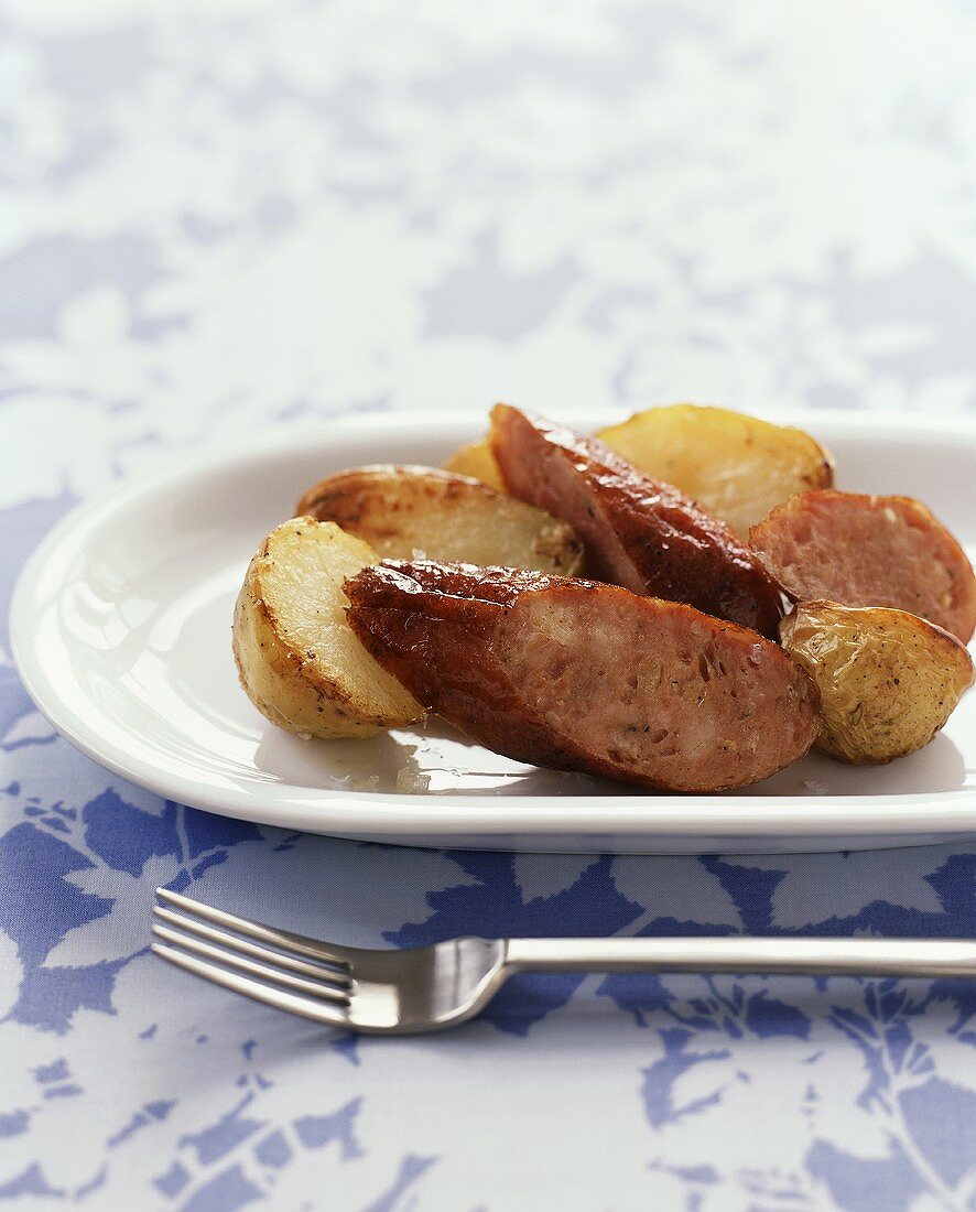 Fried sausage slices with potatoes