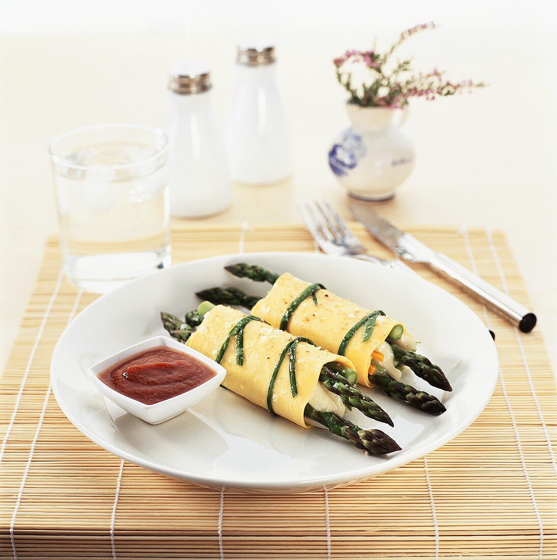 Cannelloni with asparagus filling and tomato sauce