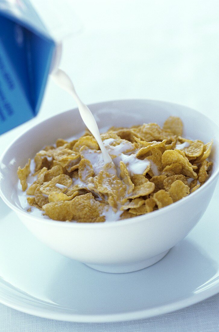 Pouring milk over cornflakes