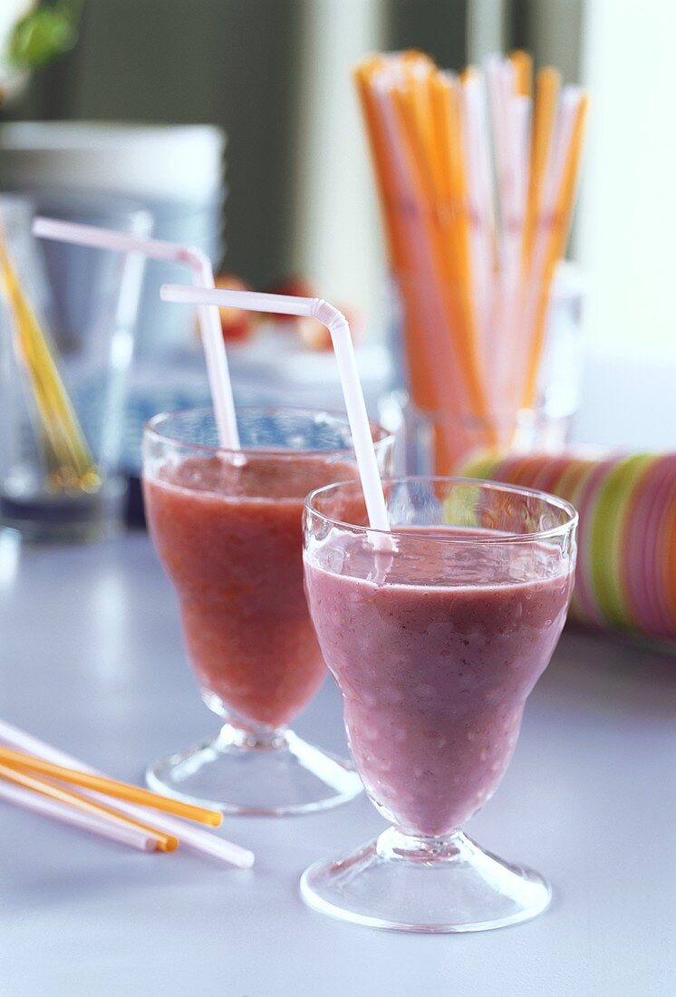 Milkshakes with raspberries and with strawberries