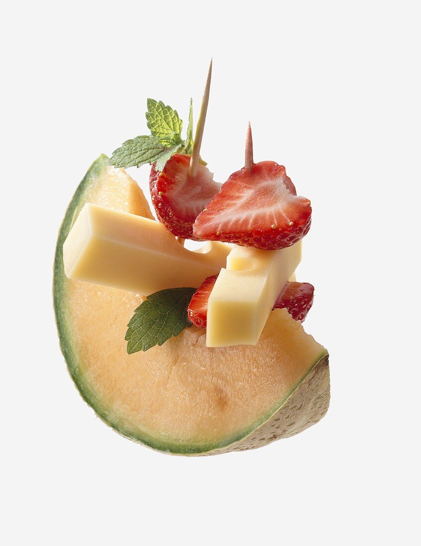 Melon with cheese and strawberries