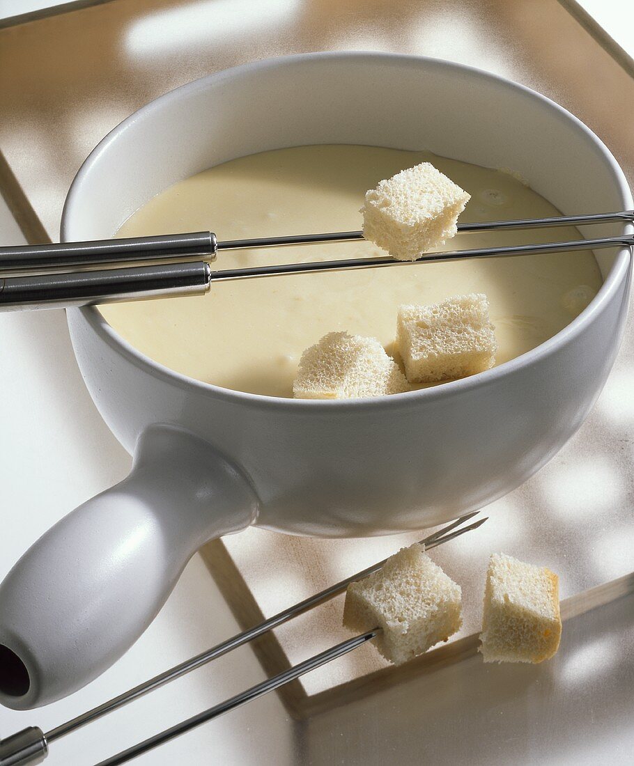 Neuchâtel fondue with cubes of white bread