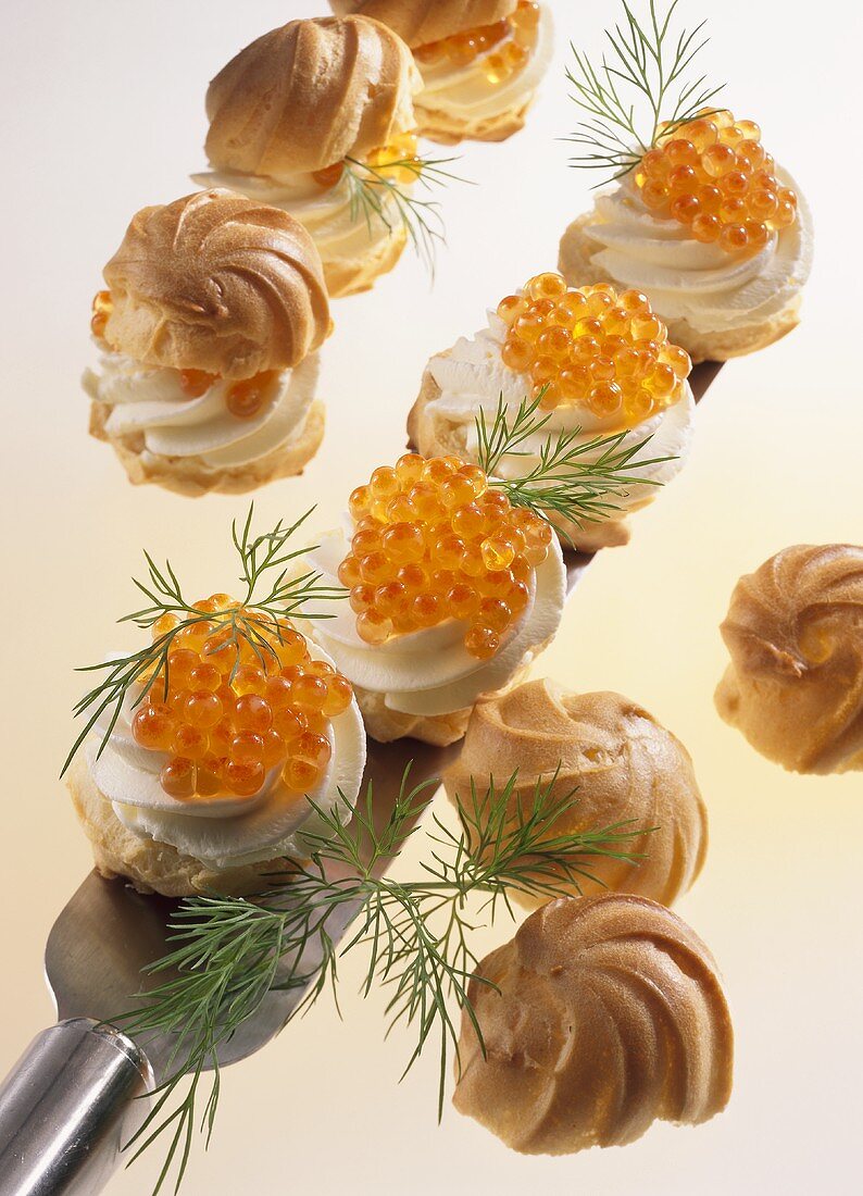 Profiteroles with fresh cheese filling and trout caviare