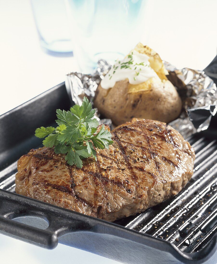 Grilled rump steak with baked potato