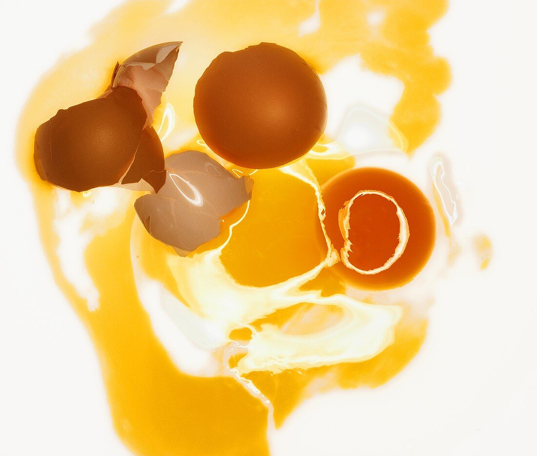 Broken egg on white background