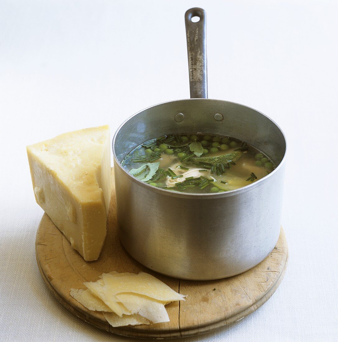 Pan of minestrone, Parmesan beside it