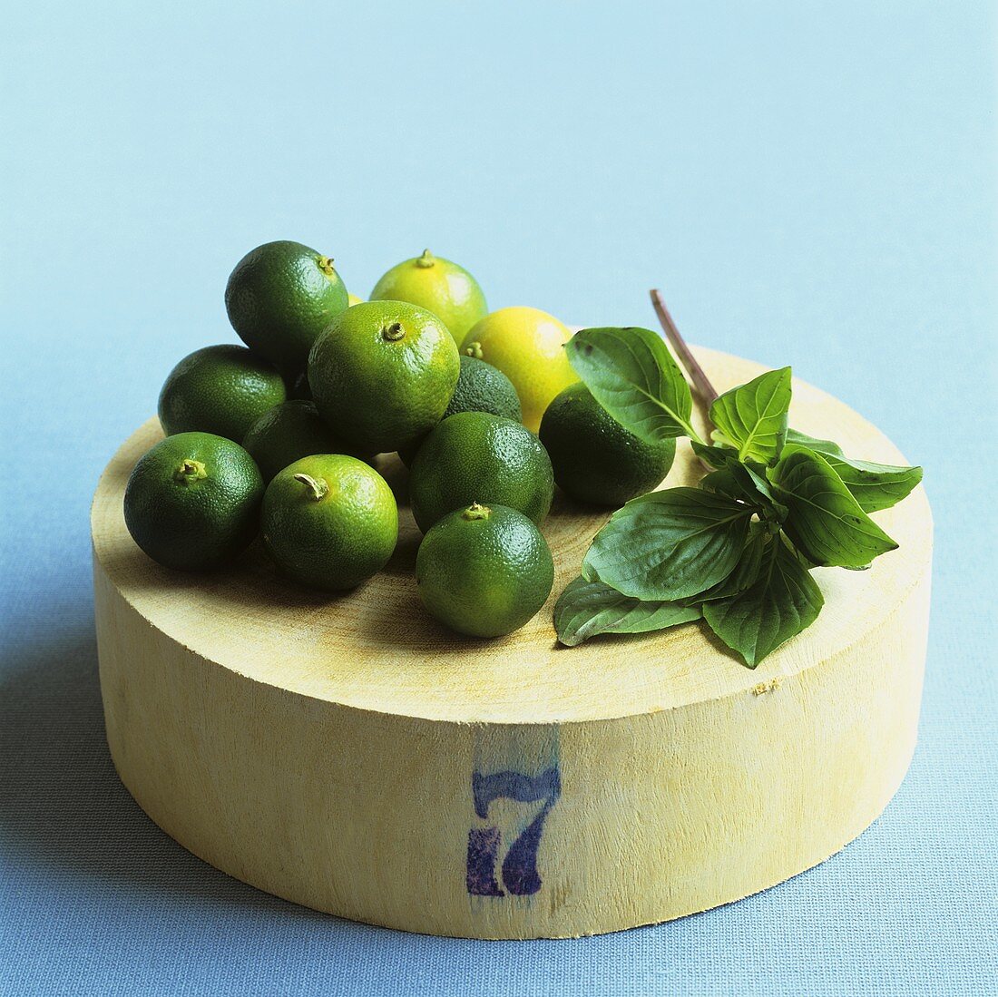 Limes on wooden board