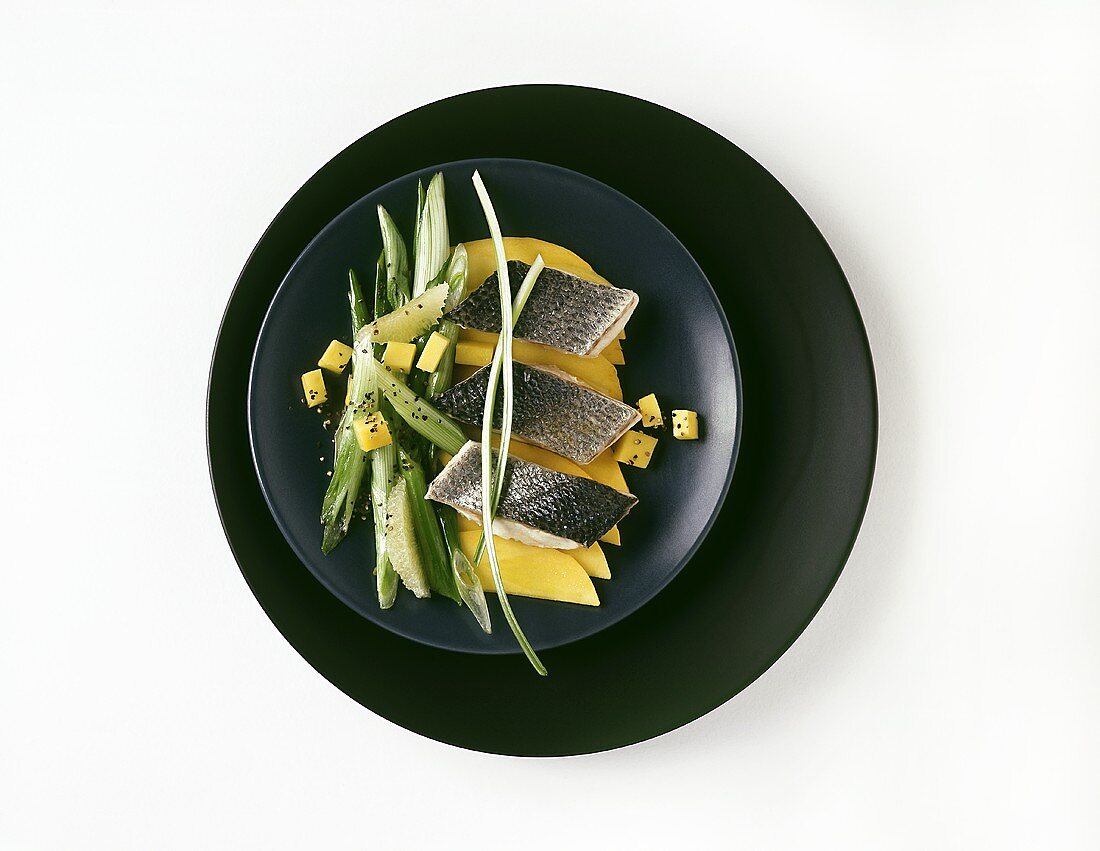 Sea bass with mango and spring onions