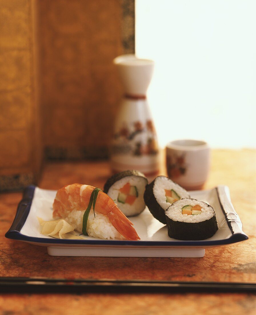 Maki-sushi and nigiri-sushi with rice wine