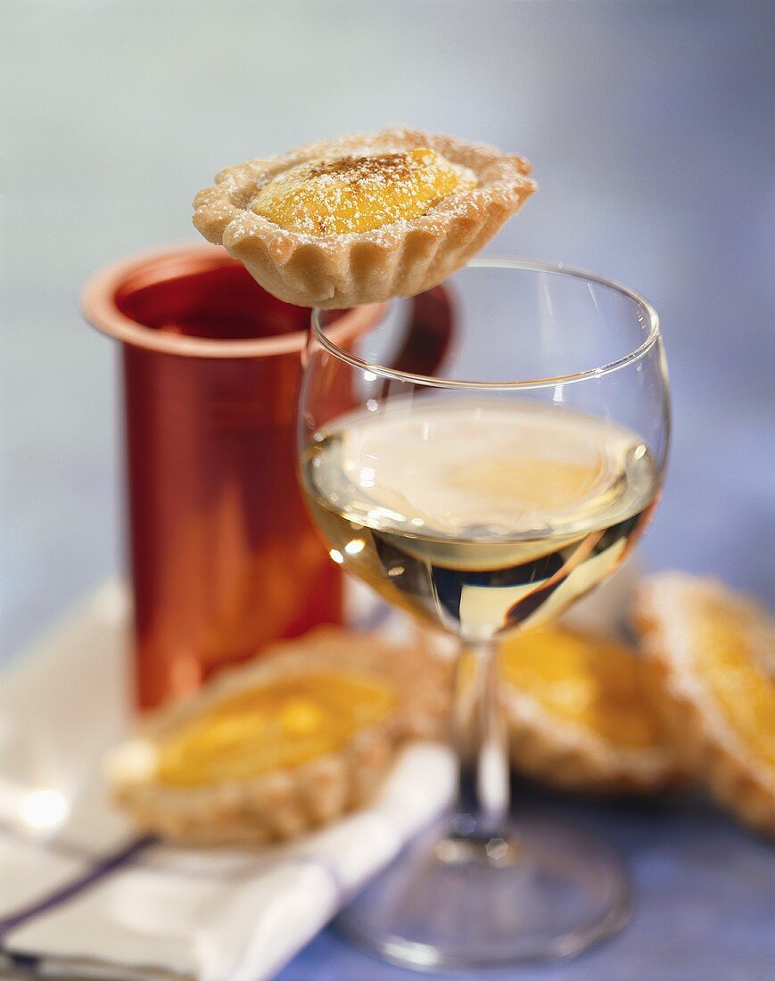 Saffron tarts and a glass of white wine