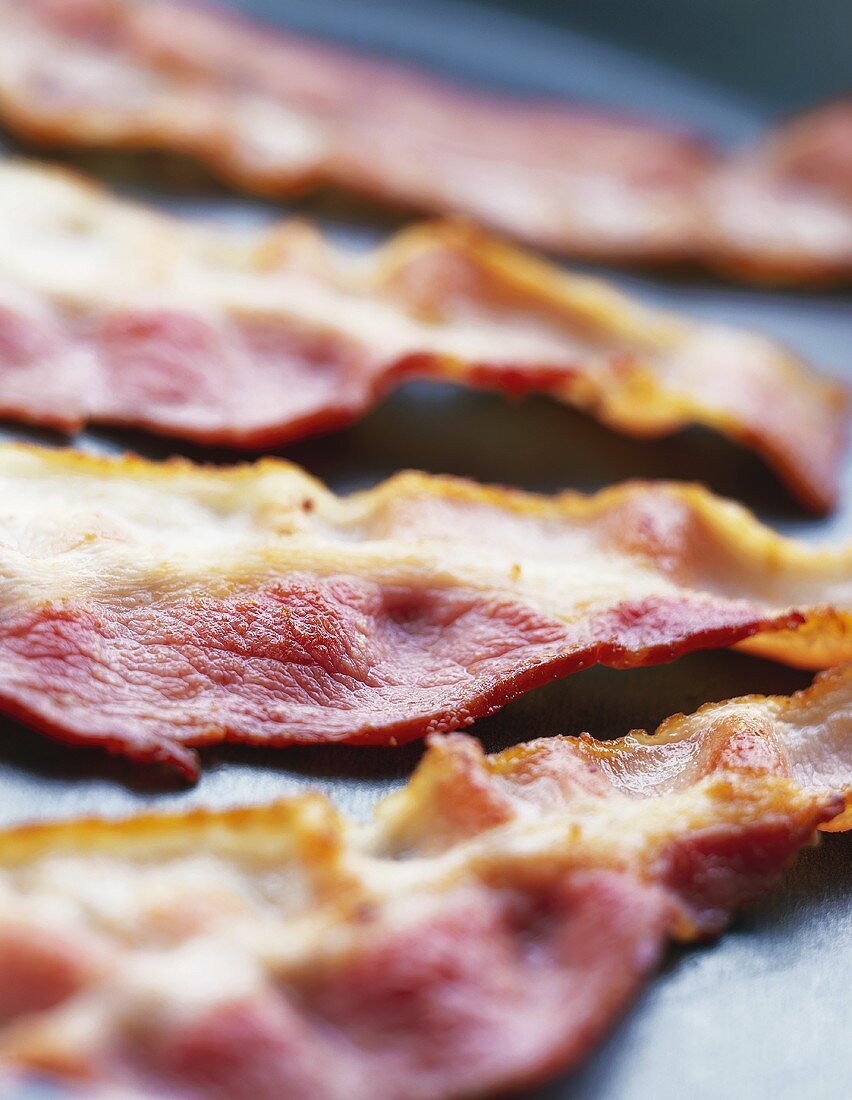 Rashers of fried bacon