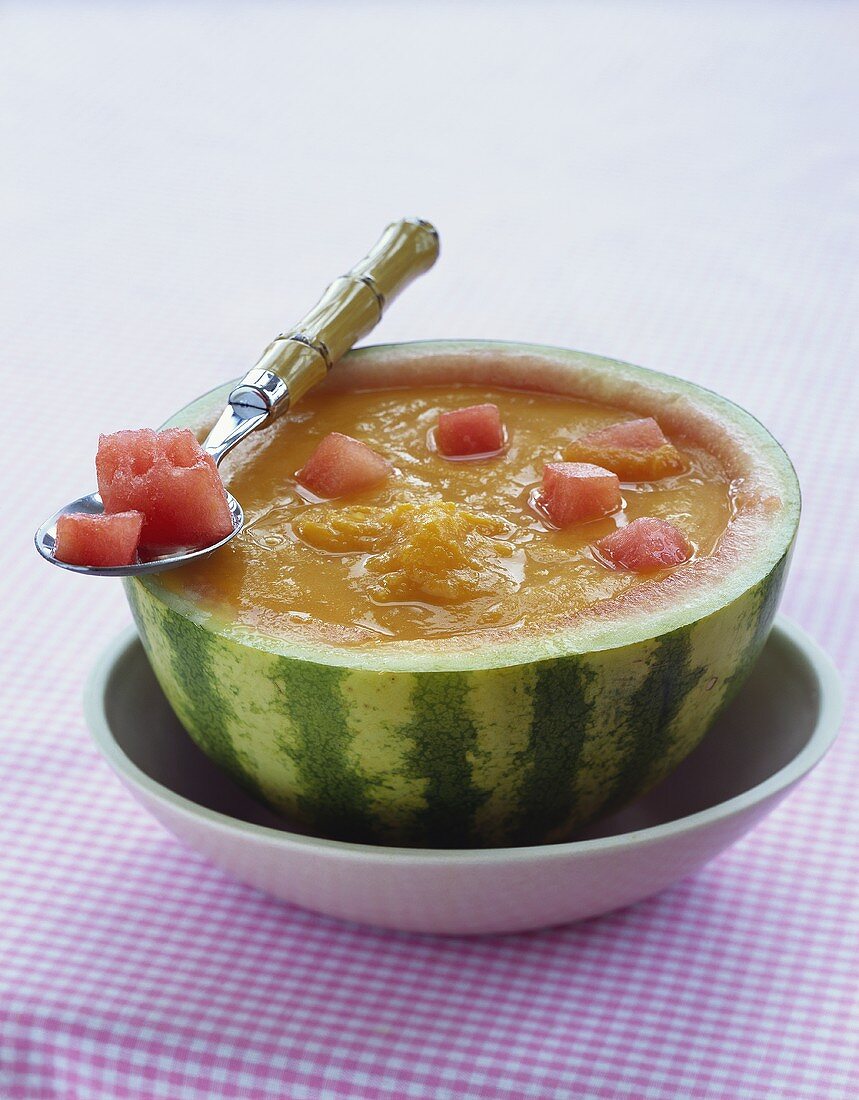 Cold melon and mango soup in hollowed-out melon