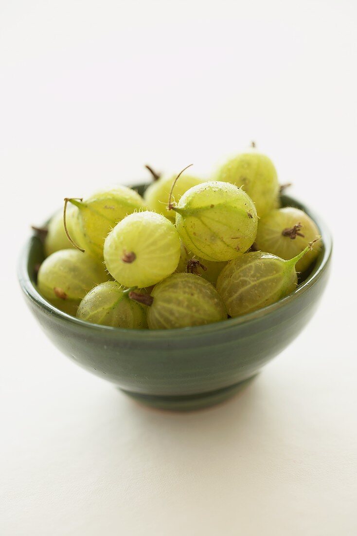 Small bowl of green gooseberries