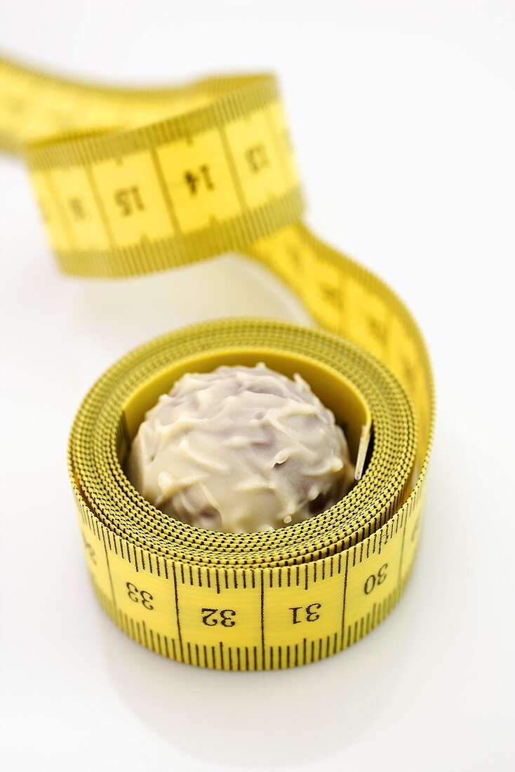 Chocolate truffle with tape measure