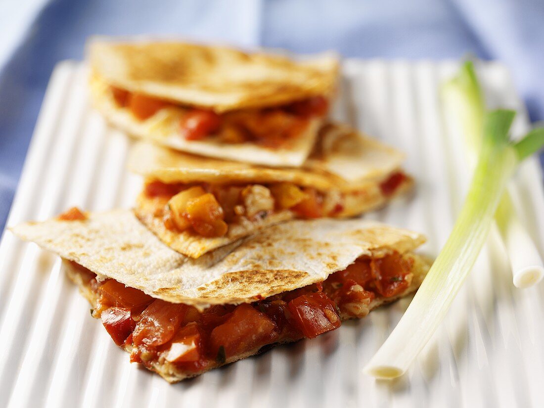 Tortilla triangles filled with salsa