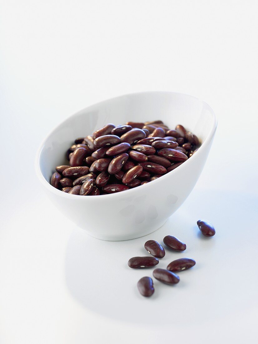 Kidney beans in and in front of a bowl