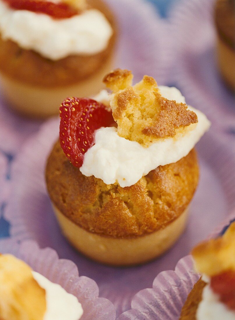 Small lemon curd bun with cream and strawberry