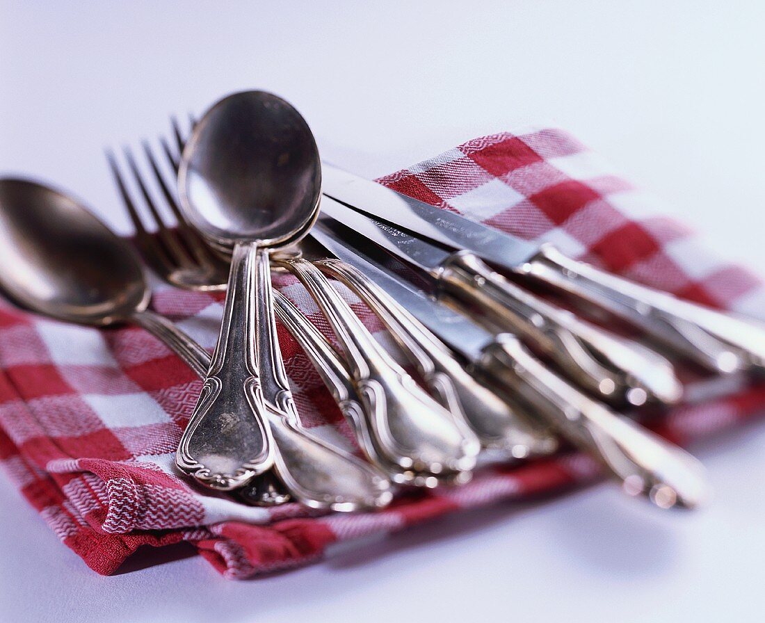 Silver cutlery on cloth
