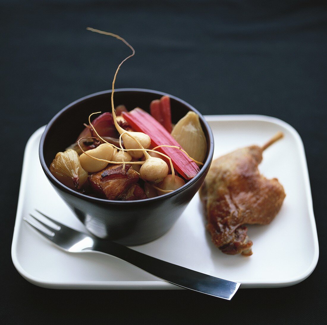 Duck with root vegetables and red chard stalks
