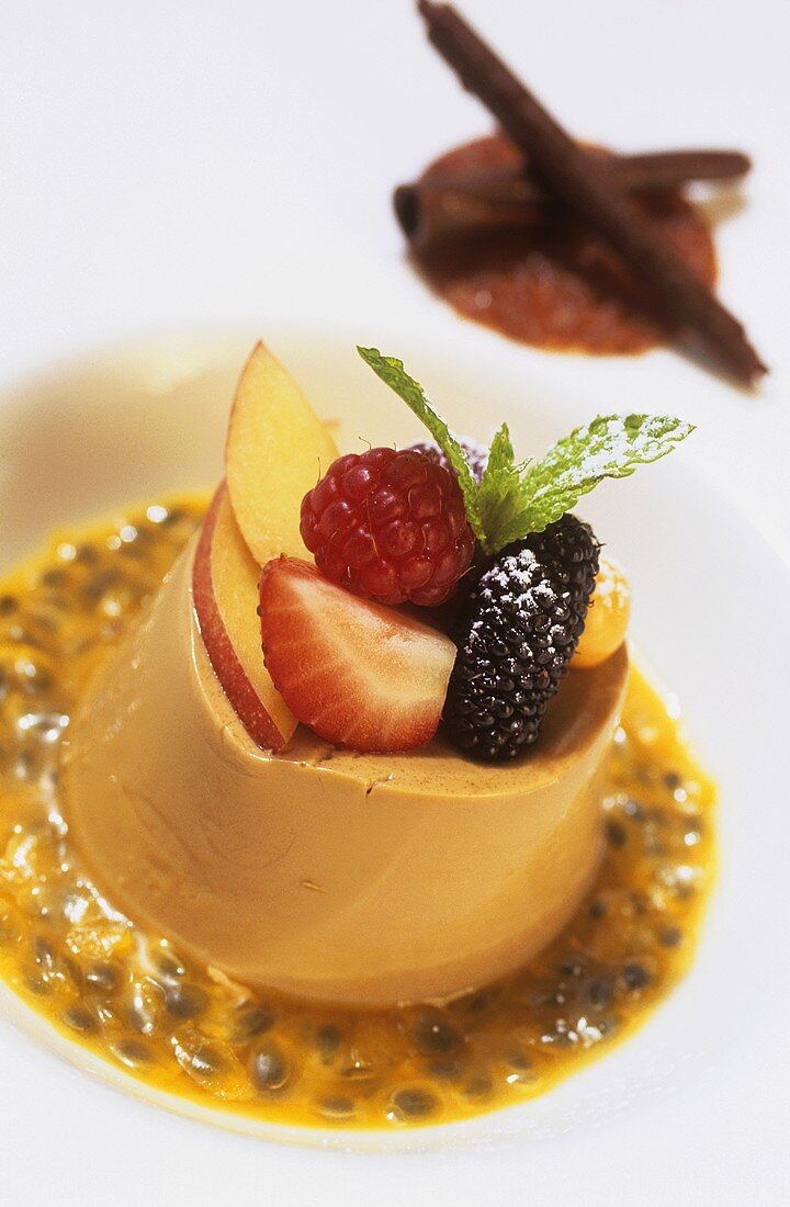 Coffee pudding with fresh fruit on passion fruit sauce