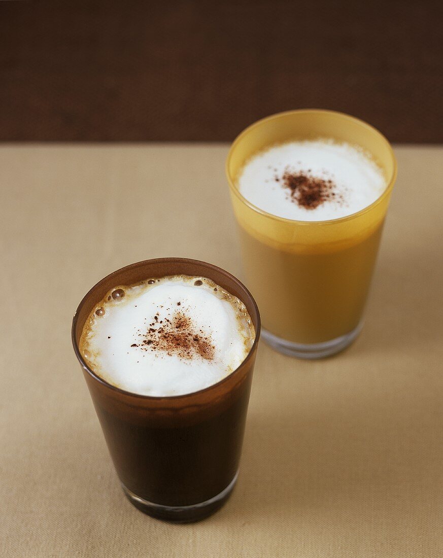 Coffee with milk froth and cocoa powder