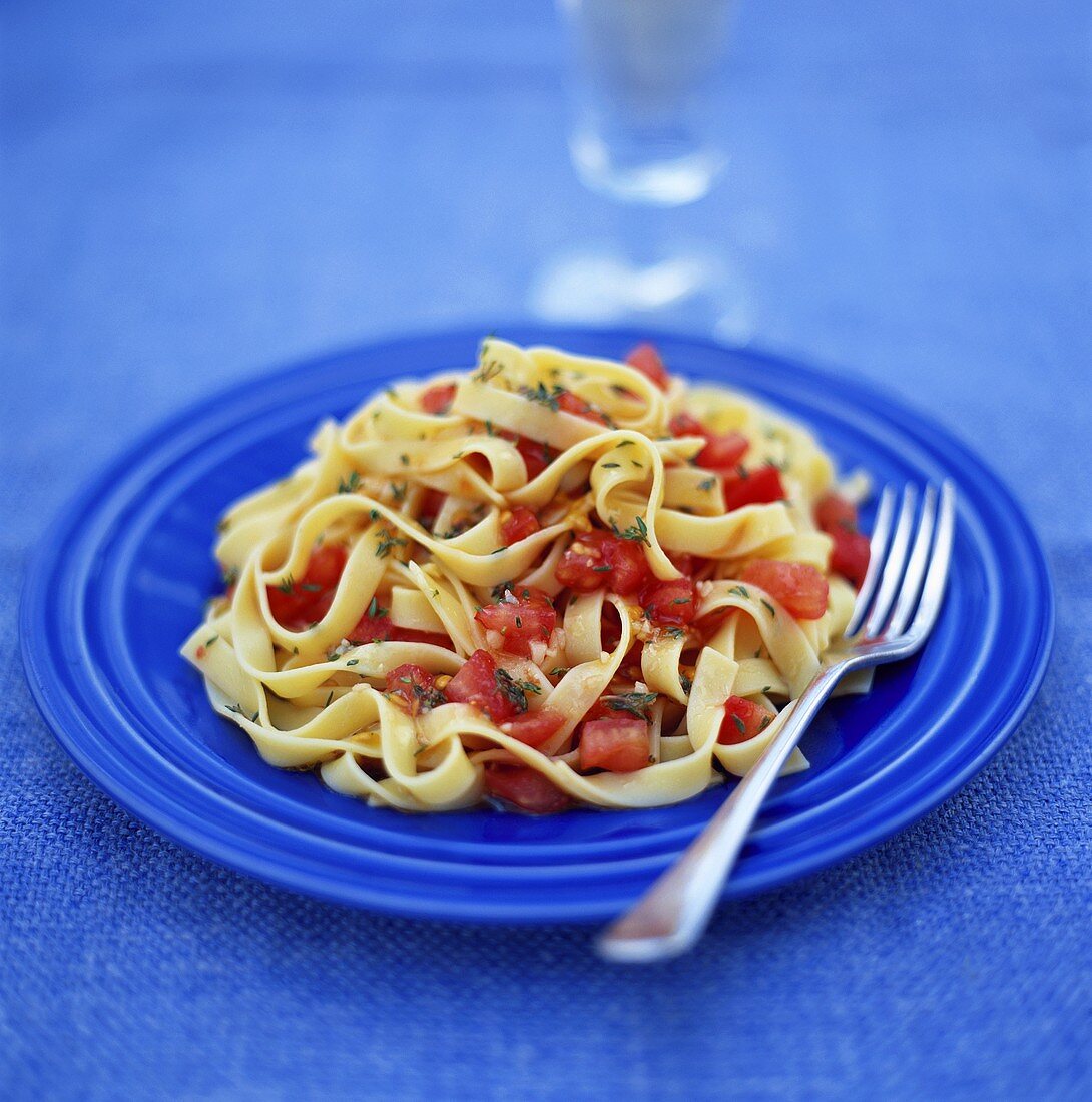 Ribbon pasta with tomatoes and thyme