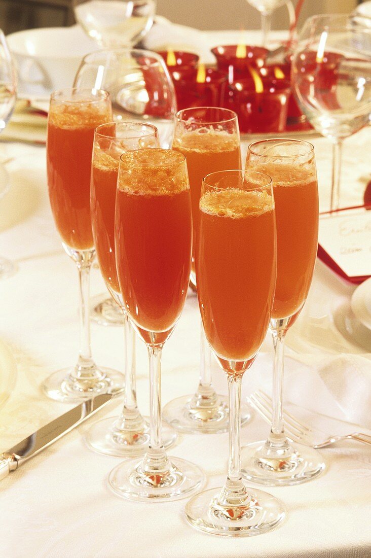 Sparkling wine cocktail with rose hip puree