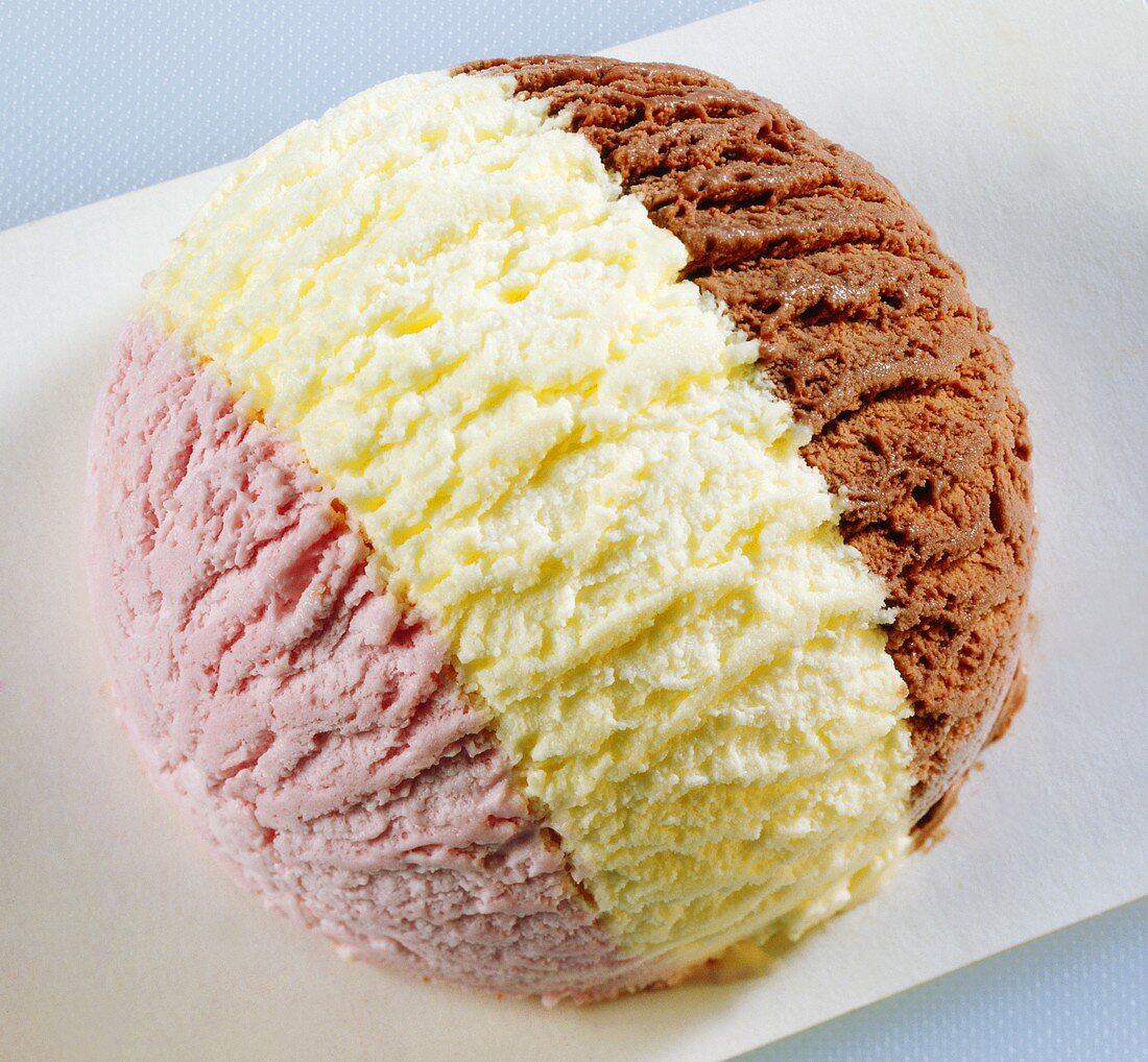Scoop of three-coloured ice cream