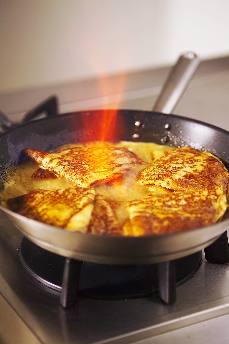 Flambéing crêpe suzette