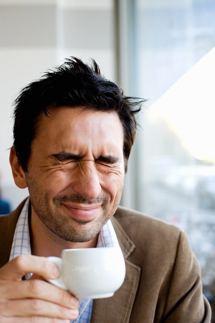 Man with coffee cup in his hand