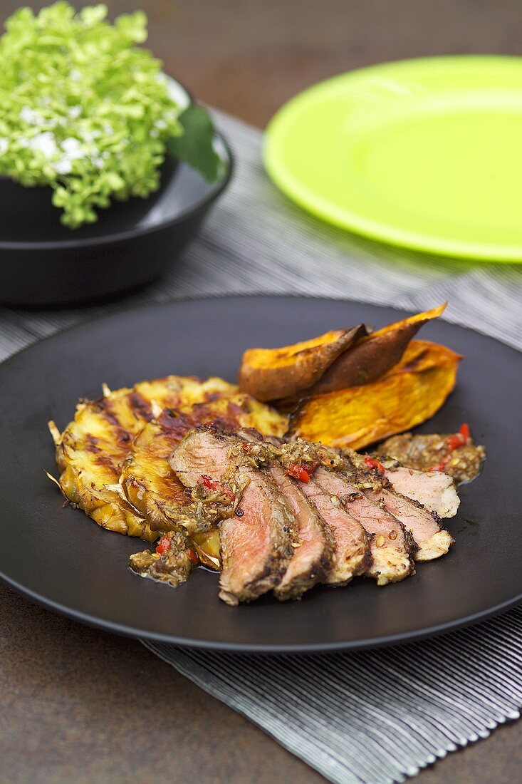Grilled beef steak with pineapple and potatoes