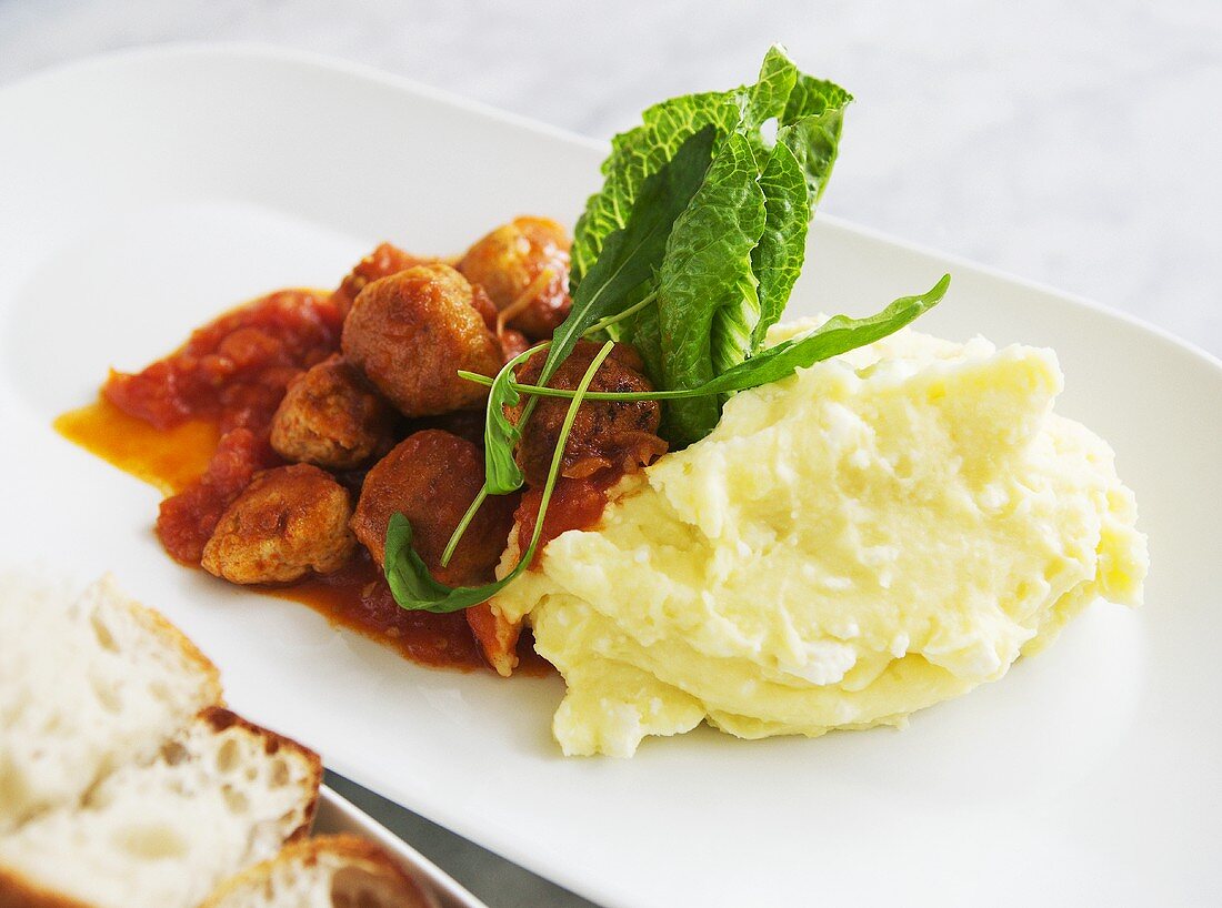 Chicken meatballs with tomato sauce and mashed potato