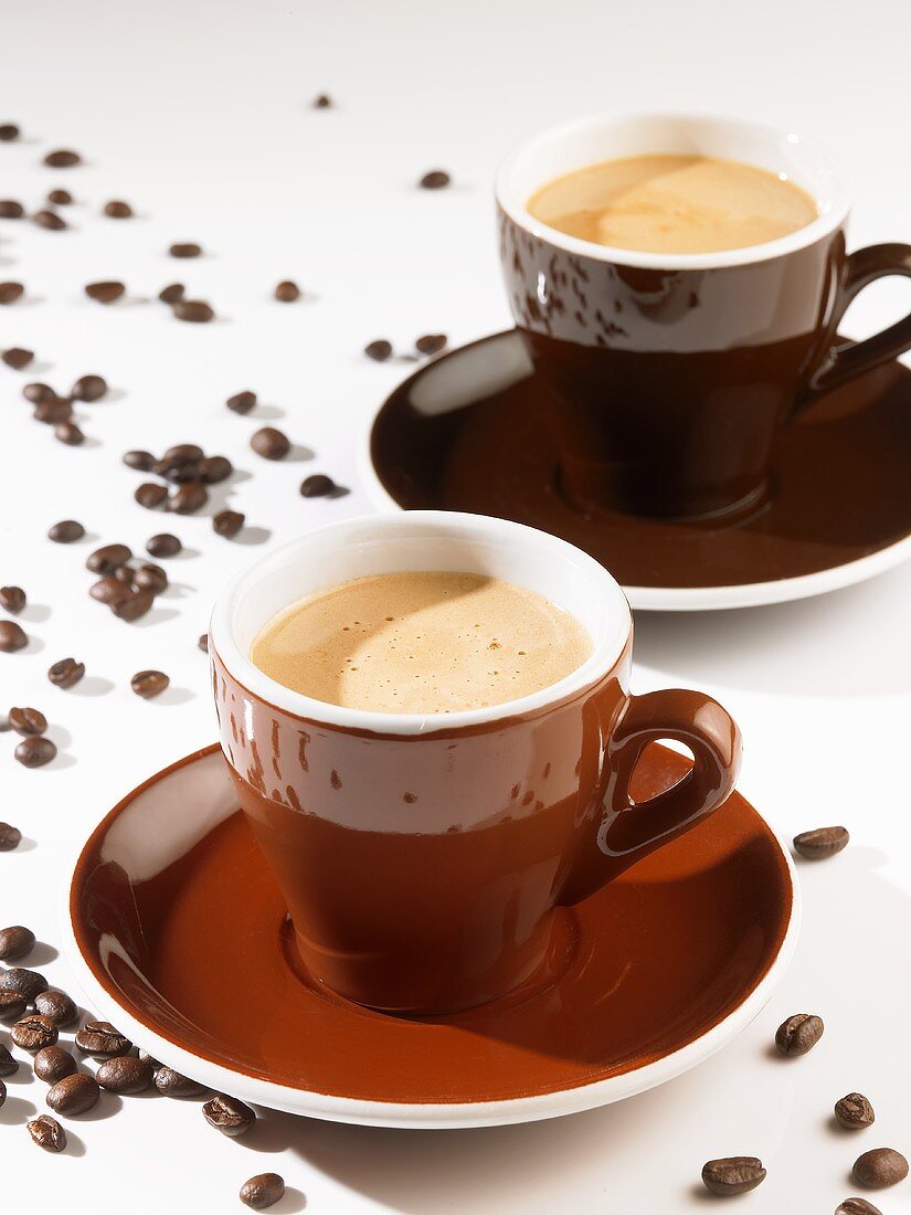 Two Cups of Espresso with Coffee Beans