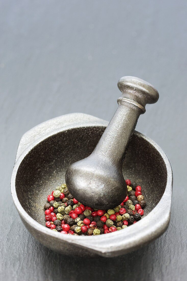 Coloured pepper in mortar