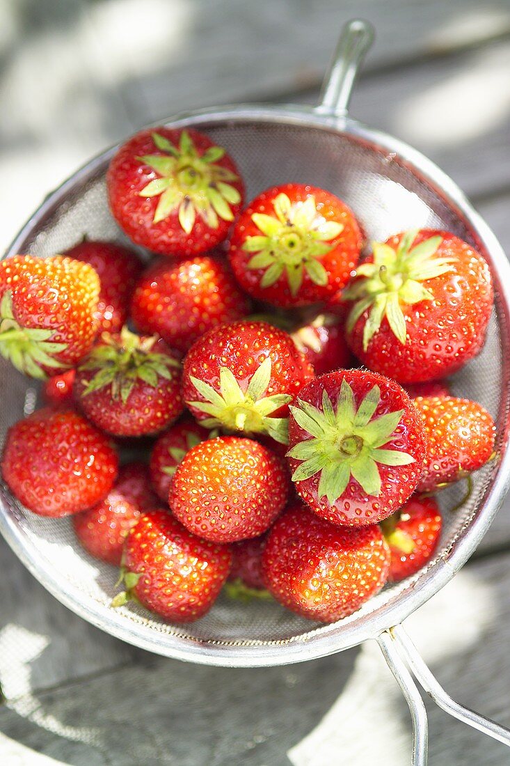 Fresh strawberries in a sieve