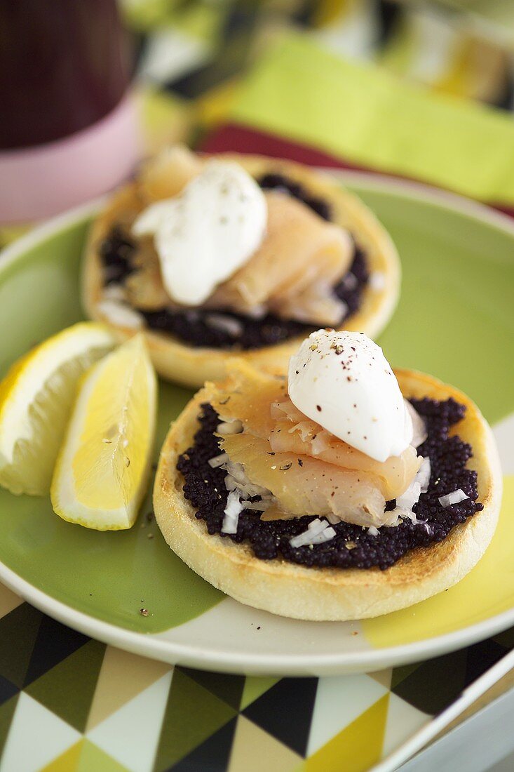 Caviar, onions, smoked salmon & crème fraîche on bread roll