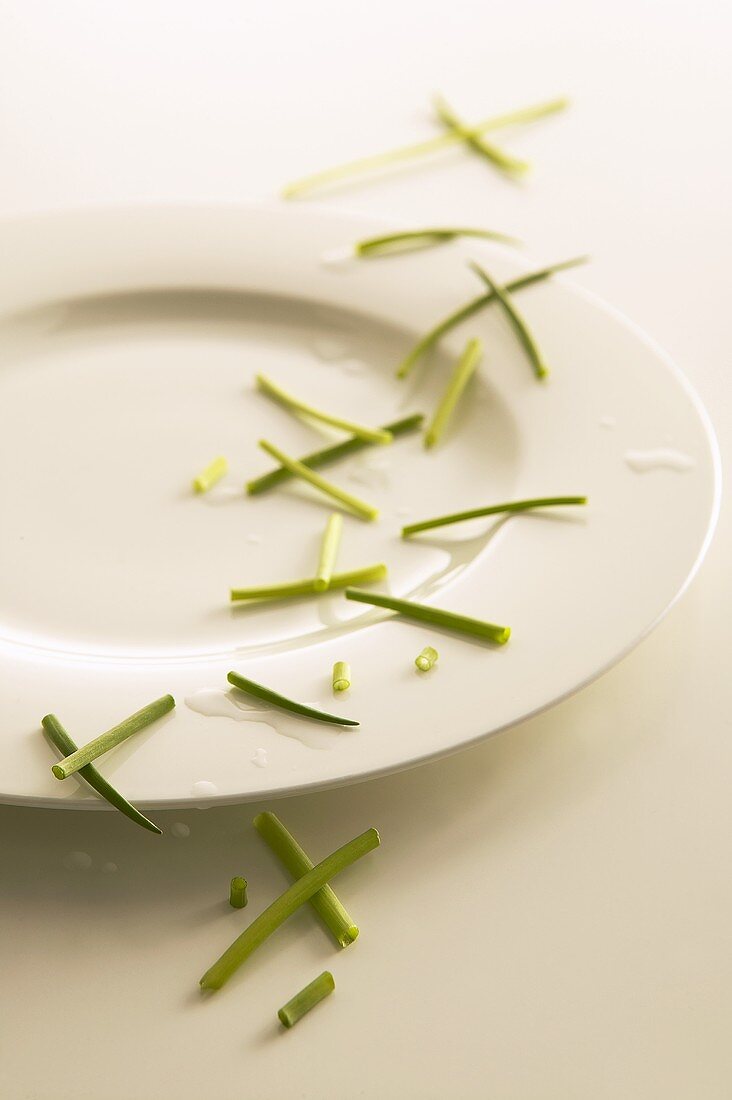 Fresh chives scattered over a plate
