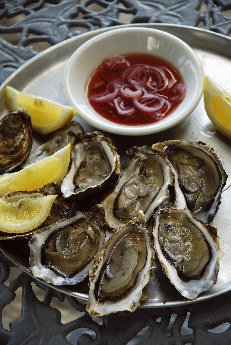 Oysters with lemon & small bowl of onions in vinegar