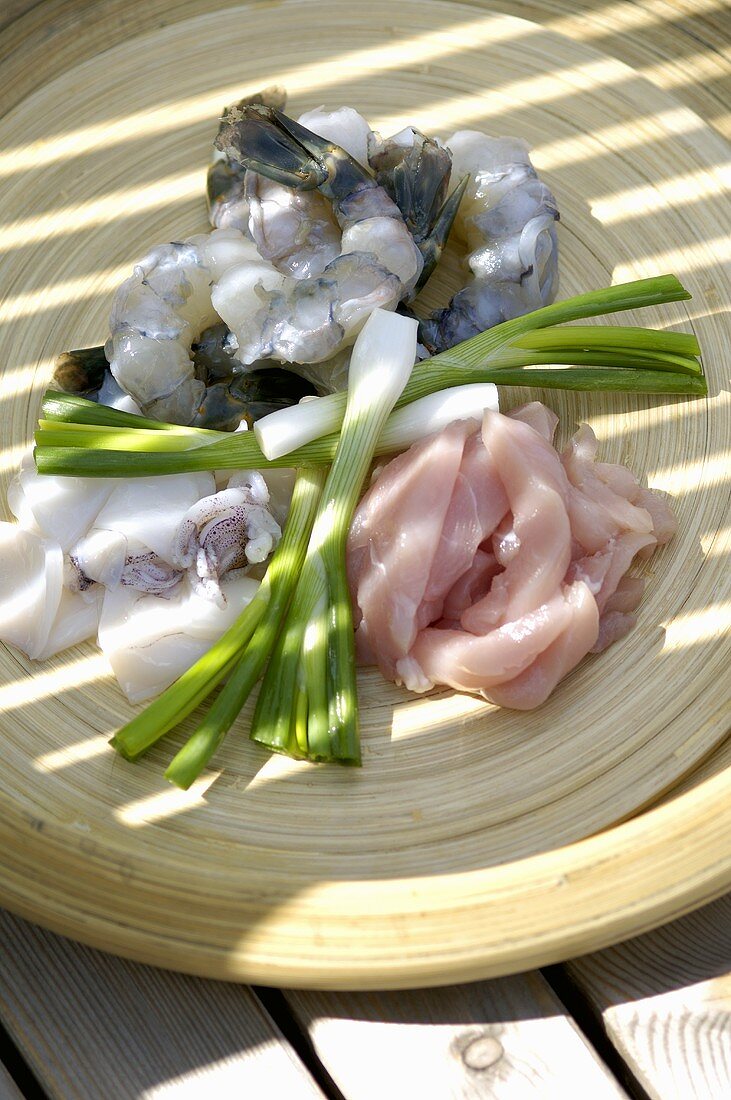 Chicken, shrimps, squid and spring onions