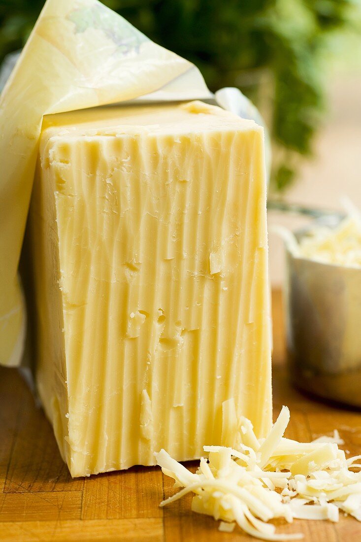 Cheddar cheese, a piece and grated