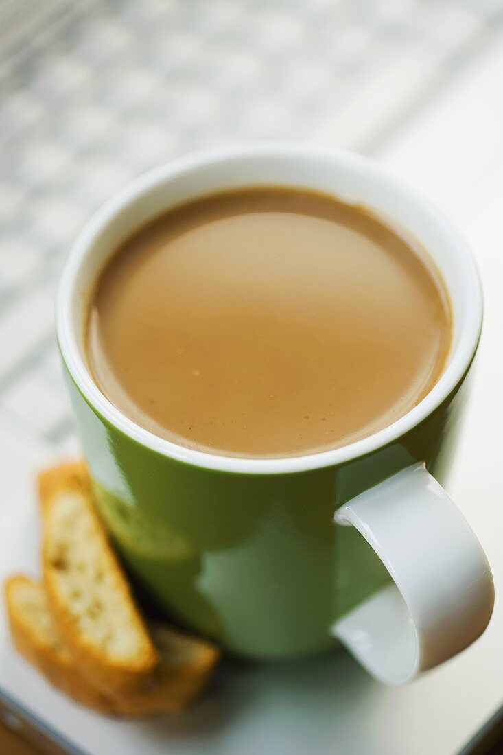 A cup of coffee with biscotti